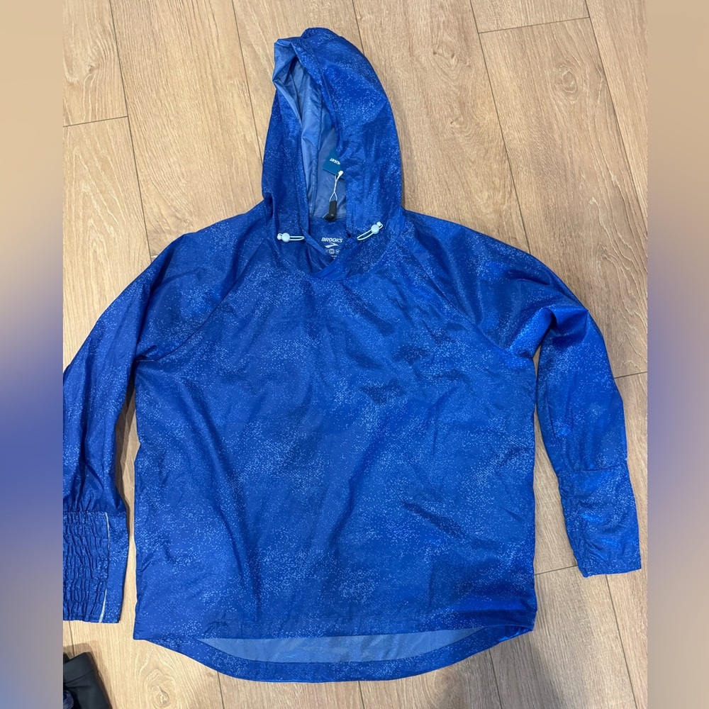 Brooks light rain pullover with hood.
